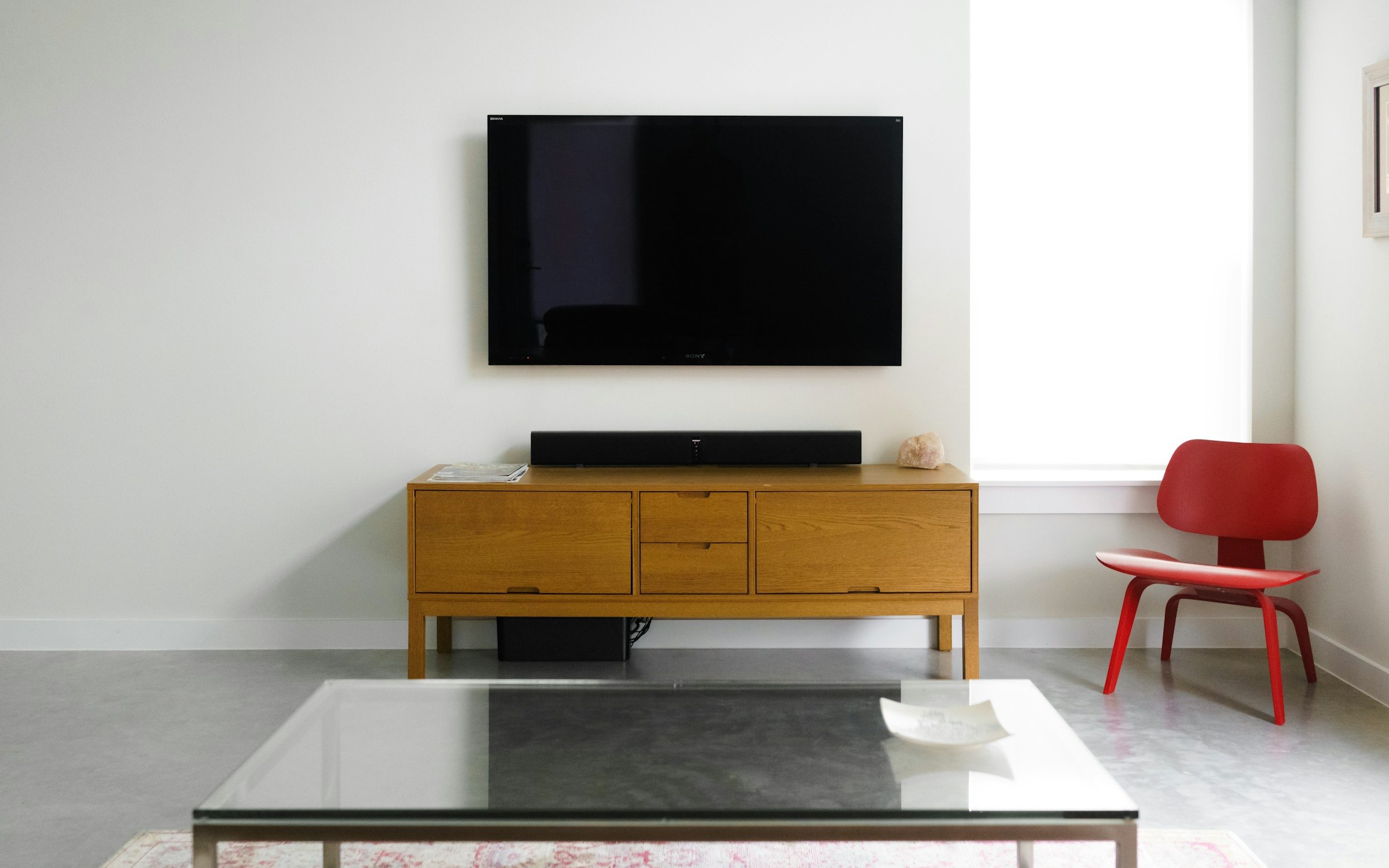 A large TV on a living room wall