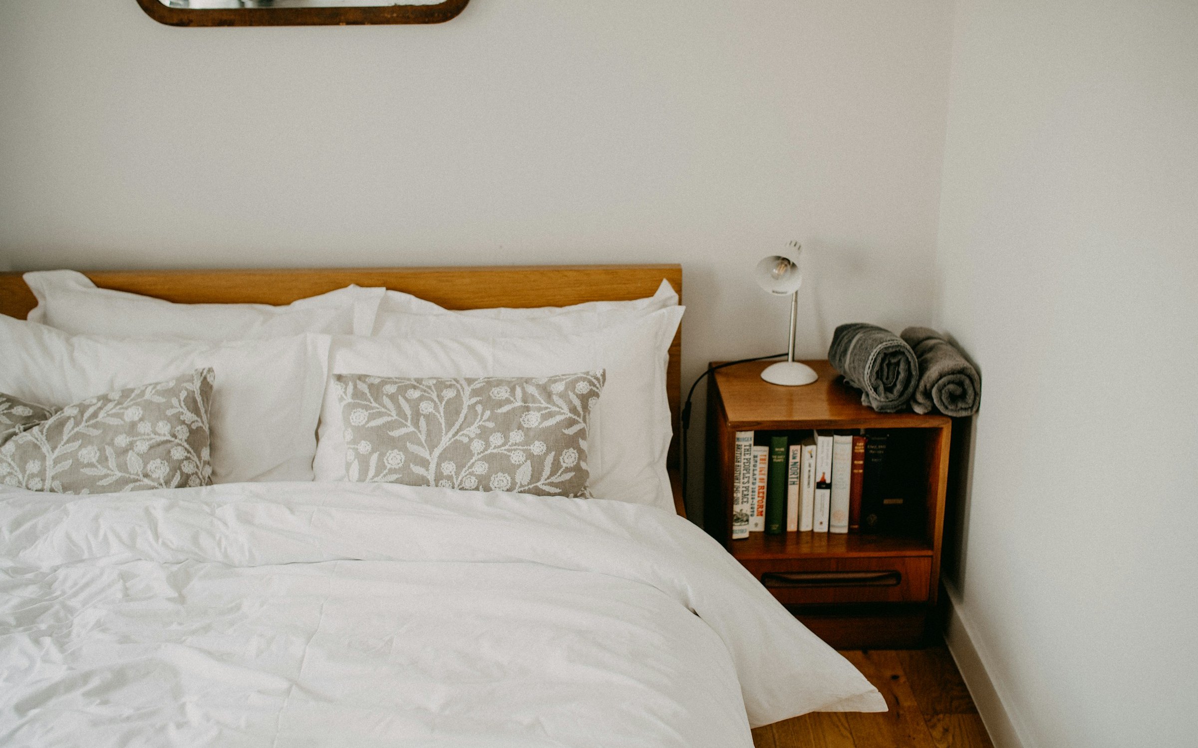 A bedroom with an oak double bed
